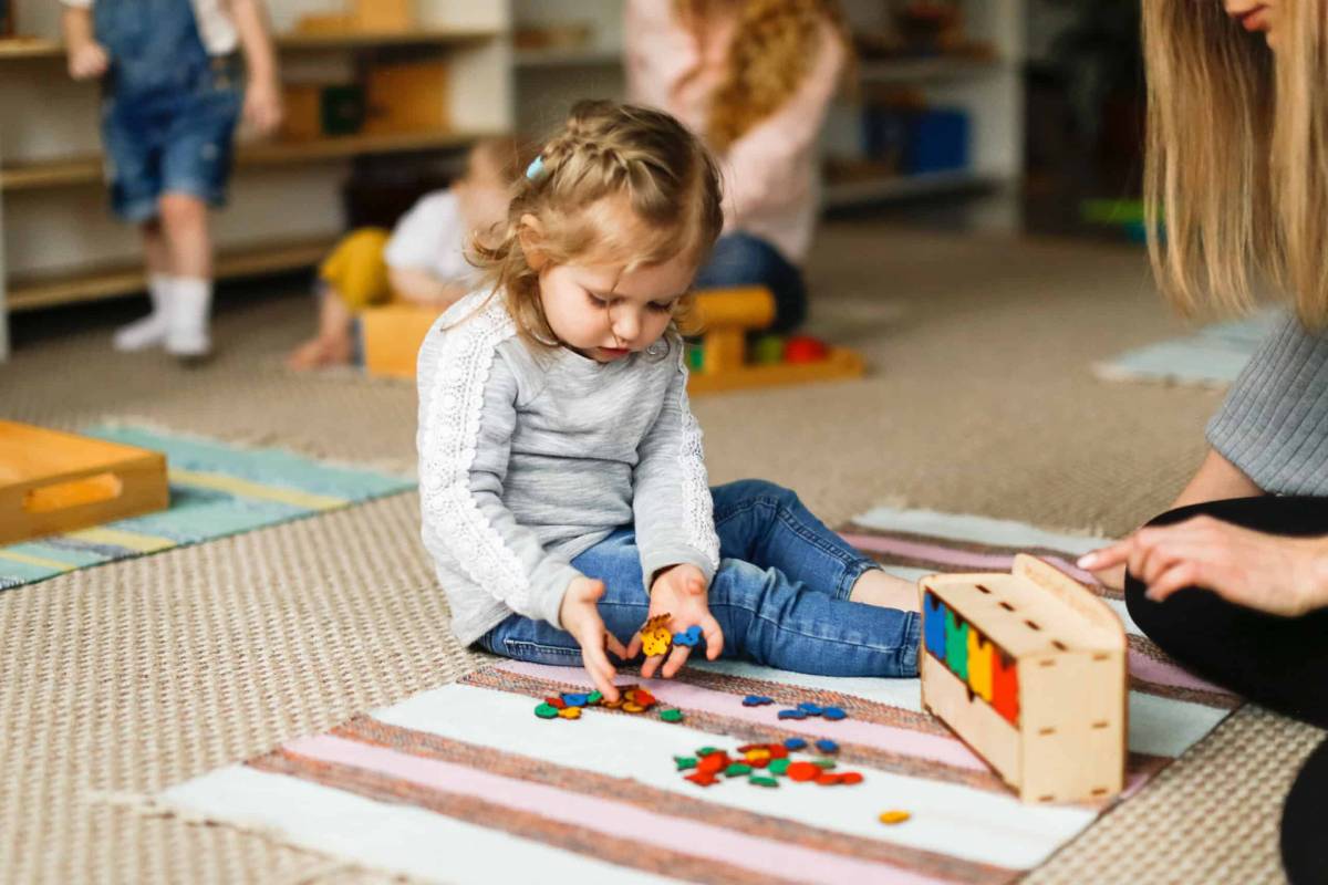 little girl play with toys